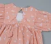 What is the key difference between a baby romper and a growsuit in design